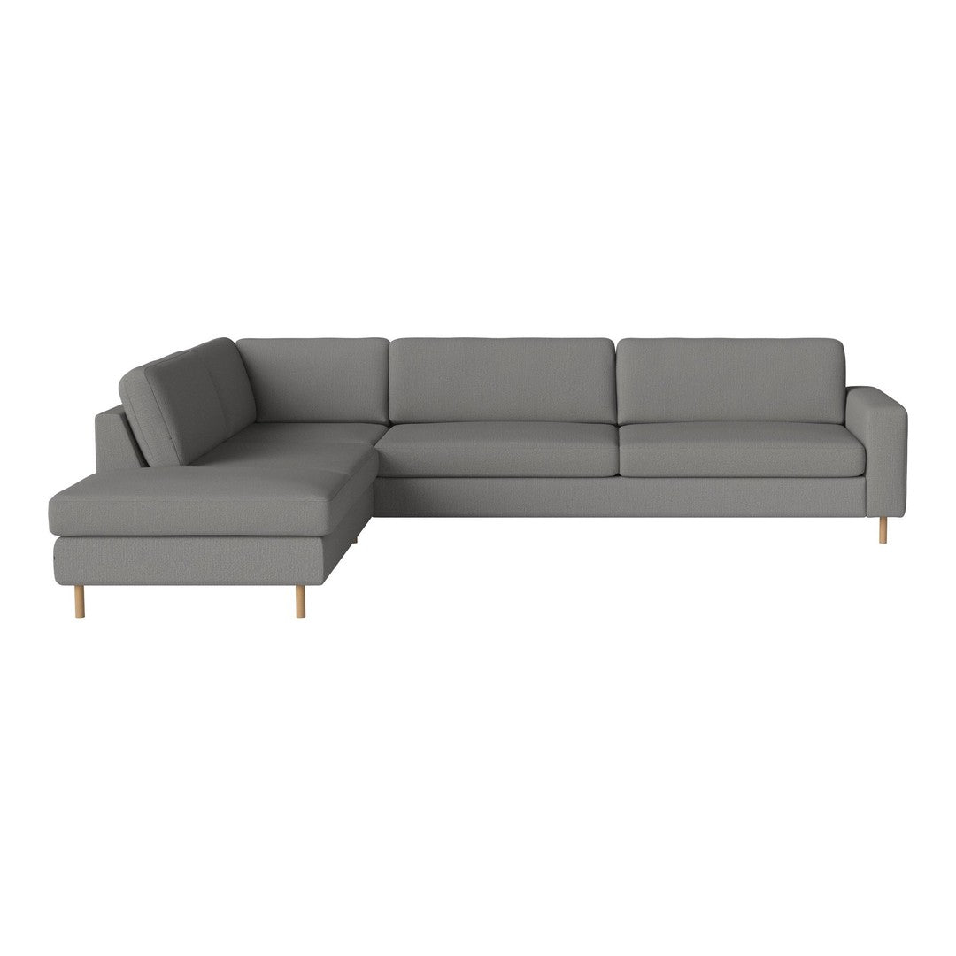 Gray sectional sofa with clean lines and subtle texture, featuring light wooden legs. Perfect for modern living spaces.