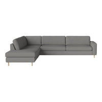 Grey sectional sofa with a modern design and smooth fabric texture, featuring light wood legs.