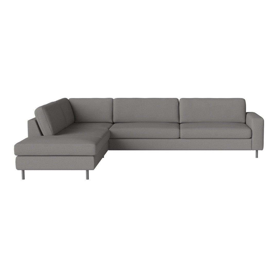 Gray sectional sofa with sleek lines and smooth upholstery, perfect for contemporary living spaces.