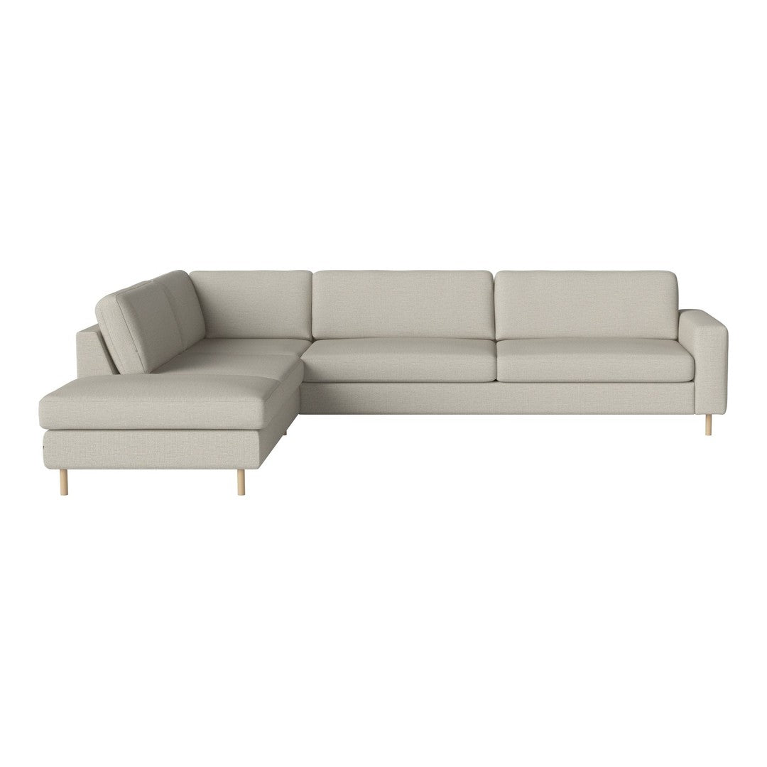 Light gray sectional sofa with clean lines and minimalistic design, featuring wooden legs for a modern look.