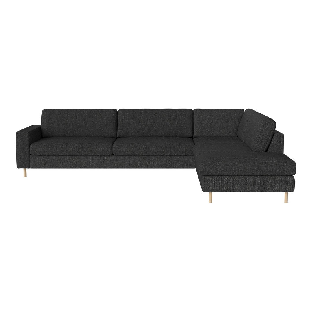 Modern dark gray sectional sofa with clean lines and minimalist design, featuring light wood legs. Perfect for chic interiors.