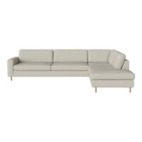 Light beige sectional sofa with clean lines and a minimalist design, featuring a smooth fabric texture.