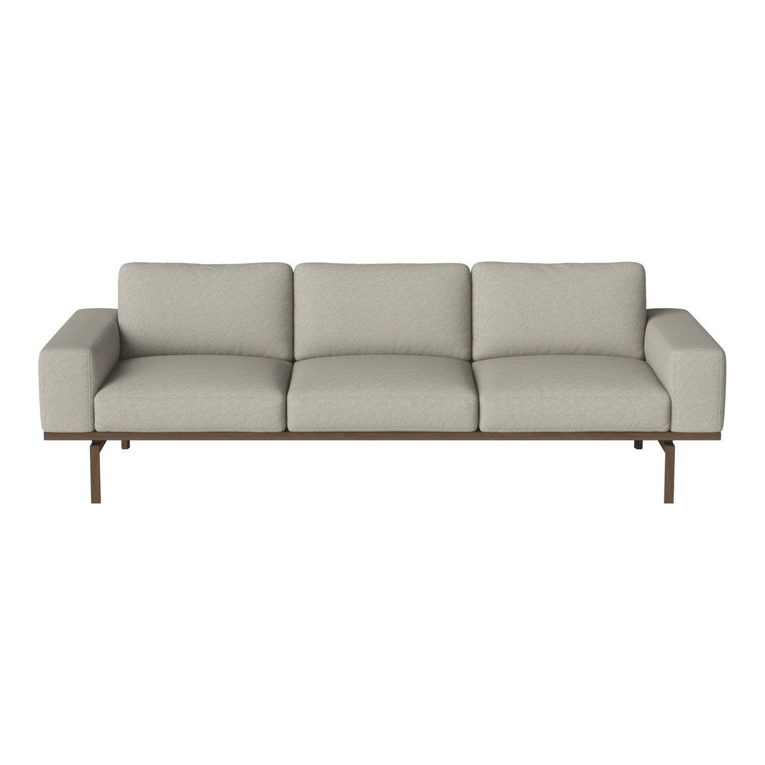 Light gray sofa with a simple, modern design and smooth fabric texture, complemented by a sleek metal frame.