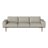 Light gray sofa with a simple, modern design and smooth fabric texture, complemented by a sleek metal frame.