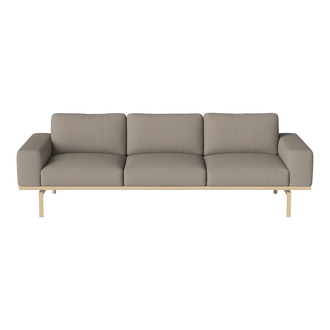Modern three-seater sofa in soft light gray fabric with a minimalist wooden frame.