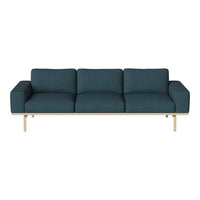 Teal fabric sofa with clean lines and a light wood frame, featuring a minimalist design and no visible patterns.