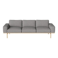 Gray upholstered sofa with clean lines and a sleek wooden base, perfect for modern decor.