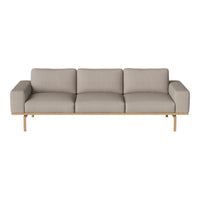 Light beige three-seater sofa with a modern design and smooth, minimalist upholstery. Natural wood legs add elegance.
