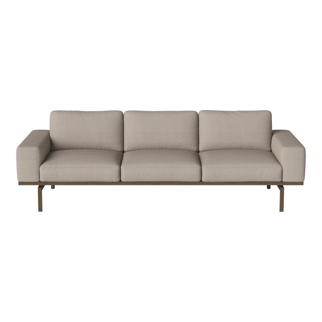 Beige fabric sofa with clean lines and minimalist design, featuring a sleek metal frame. Perfect for modern decor.