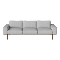 Light gray three-seater sofa with smooth upholstery and minimalist design, featuring a sleek wooden frame.