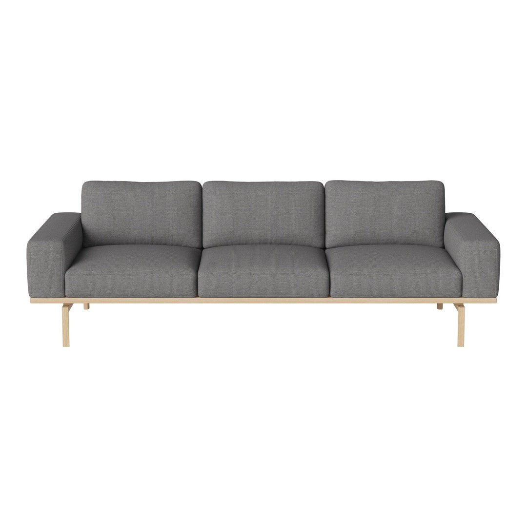 Gray upholstered sofa with solid wooden legs and a clean, modern design. Elegant and minimalist style for any space.