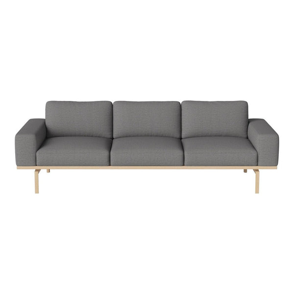 Gray upholstered sofa with solid wooden legs and a clean, modern design. Elegant and minimalist style for any space.