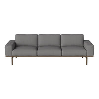 Gray upholstered sofa with a sleek design and subtle textured pattern, featuring a minimalist brown metal frame.