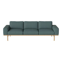 Teal modern sofa with textured fabric and wooden base, perfect for contemporary living spaces.