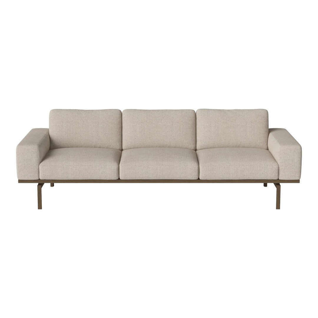 Light beige three-seat sofa with smooth, textured fabric and minimalist design. Elegant metal legs in a warm finish.