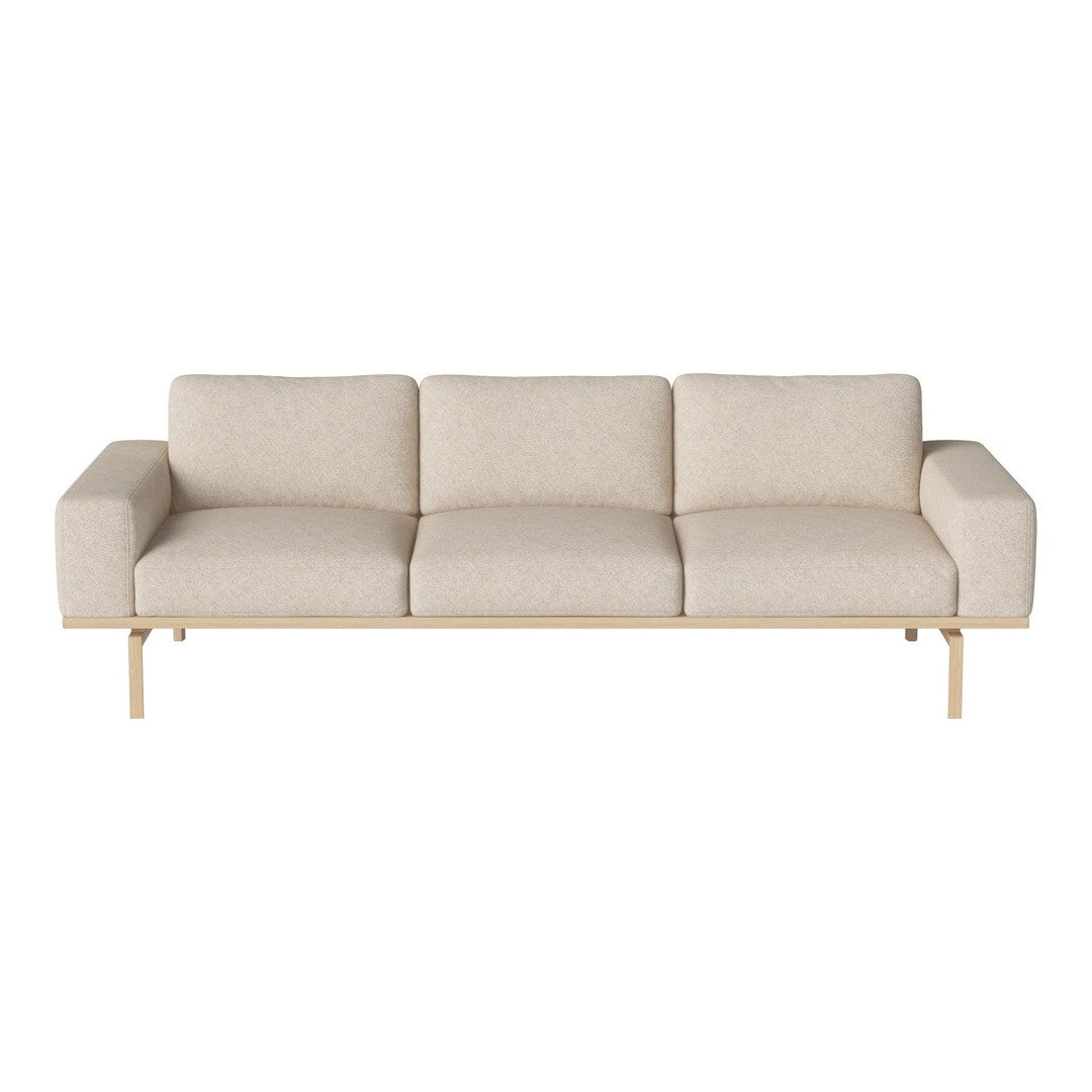 Light beige sofa with a minimalist design, featuring smooth fabric and a natural wood base.