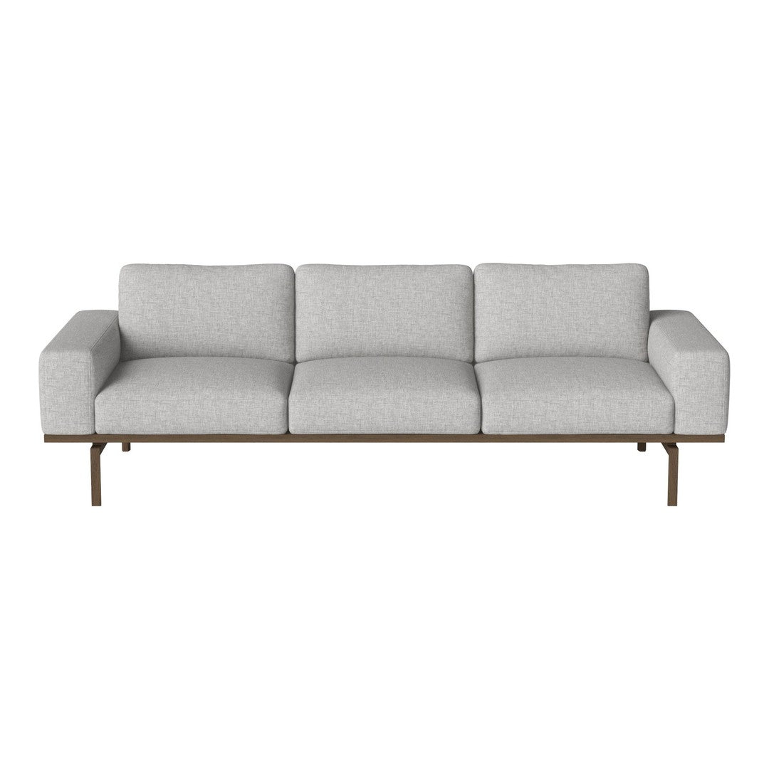 Light gray sofa with a minimalist design, featuring smooth fabric upholstery and sleek wooden legs.