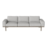 Light gray sofa with a minimalist design, featuring smooth fabric upholstery and sleek wooden legs.