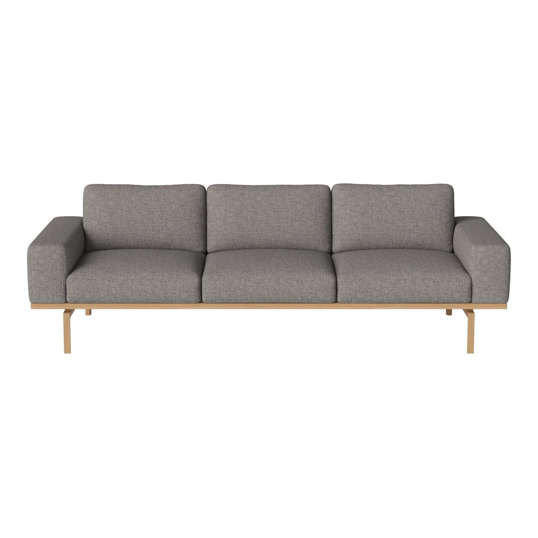 Gray upholstered sofa with a modern, minimalist design and wooden legs, perfect for contemporary interiors.