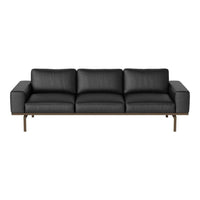 Modern black leather sofa with clean lines and a sleek metal frame, ideal for contemporary living spaces.