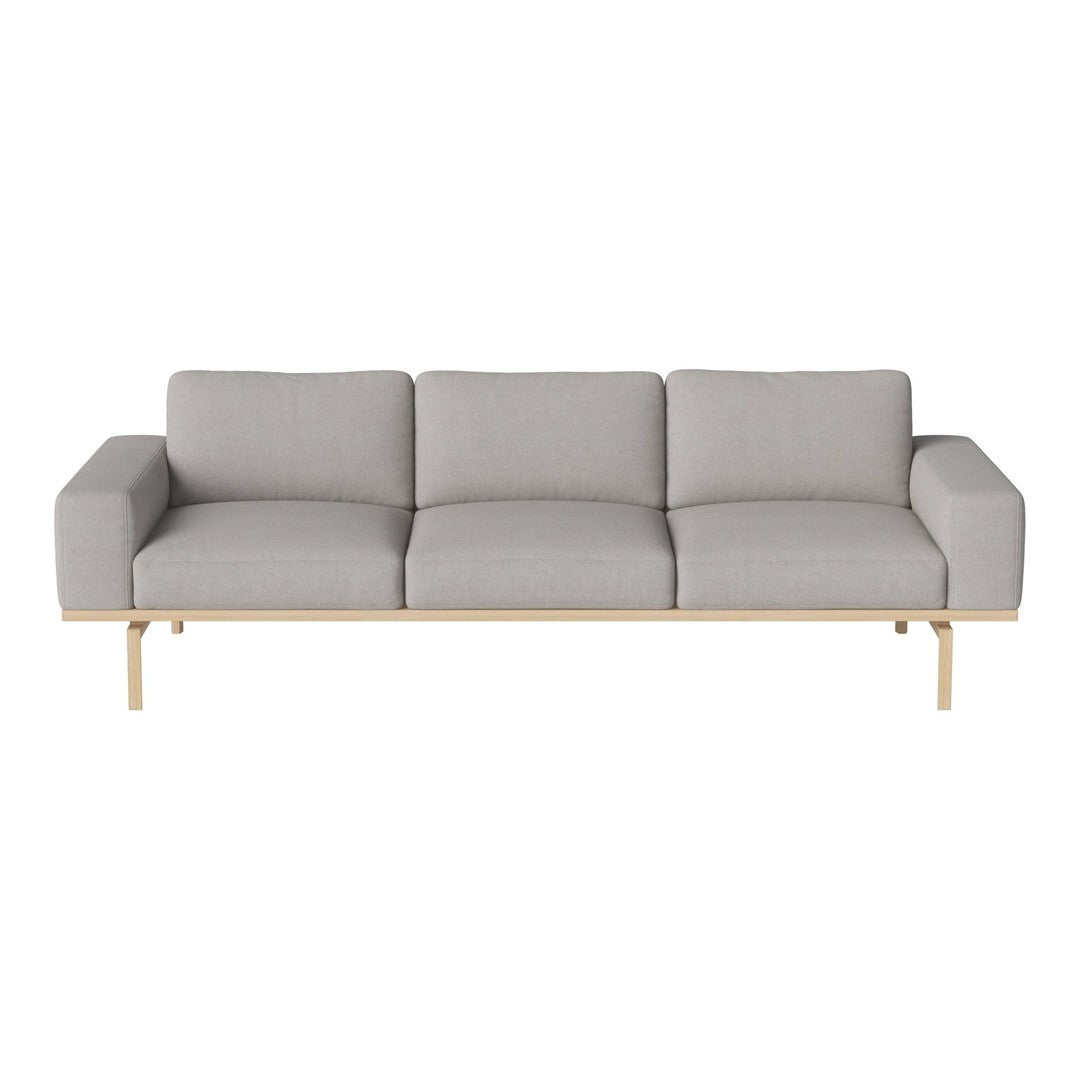 Light gray modern sofa with clean lines and minimalist design, featuring plush cushions and a natural wood base.