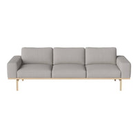 Light gray modern sofa with clean lines and minimalist design, featuring plush cushions and a natural wood base.