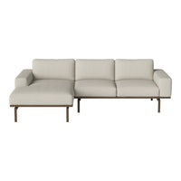 Light beige sectional sofa with a sleek, modern design and solid wood accents, featuring a smooth, textured fabric.