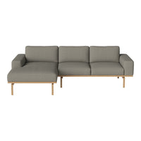 Gray fabric sectional sofa with a minimalist design and light wood legs. Perfect for modern living spaces.