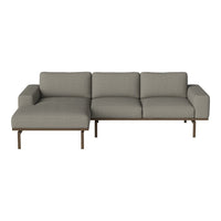 Gray sectional sofa with clean lines and a modern design, featuring a sleek fabric finish and minimalistic structure.