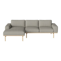 Gray fabric sectional sofa with a minimalist design and light wooden legs, perfect for modern living spaces.