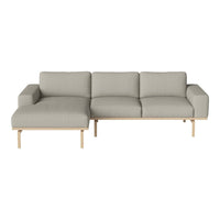 Light gray sectional sofa with clean lines and minimalistic wooden legs, perfect for modern interiors.
