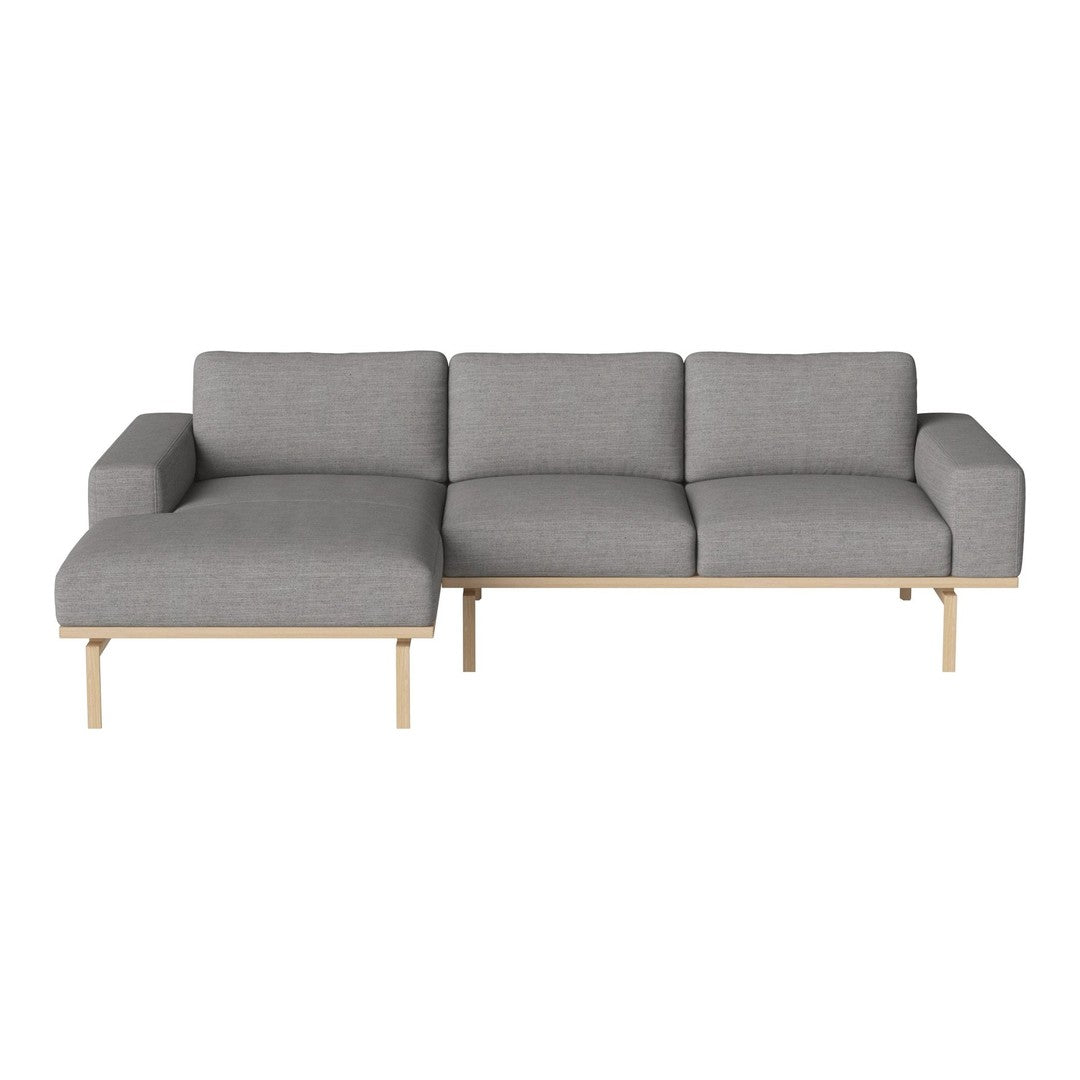 Modern gray sectional sofa with clean lines, subtle texture, and light wood accents. Ideal for contemporary decor.