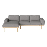 Modern gray sectional sofa with clean lines, subtle texture, and light wood accents. Ideal for contemporary decor.