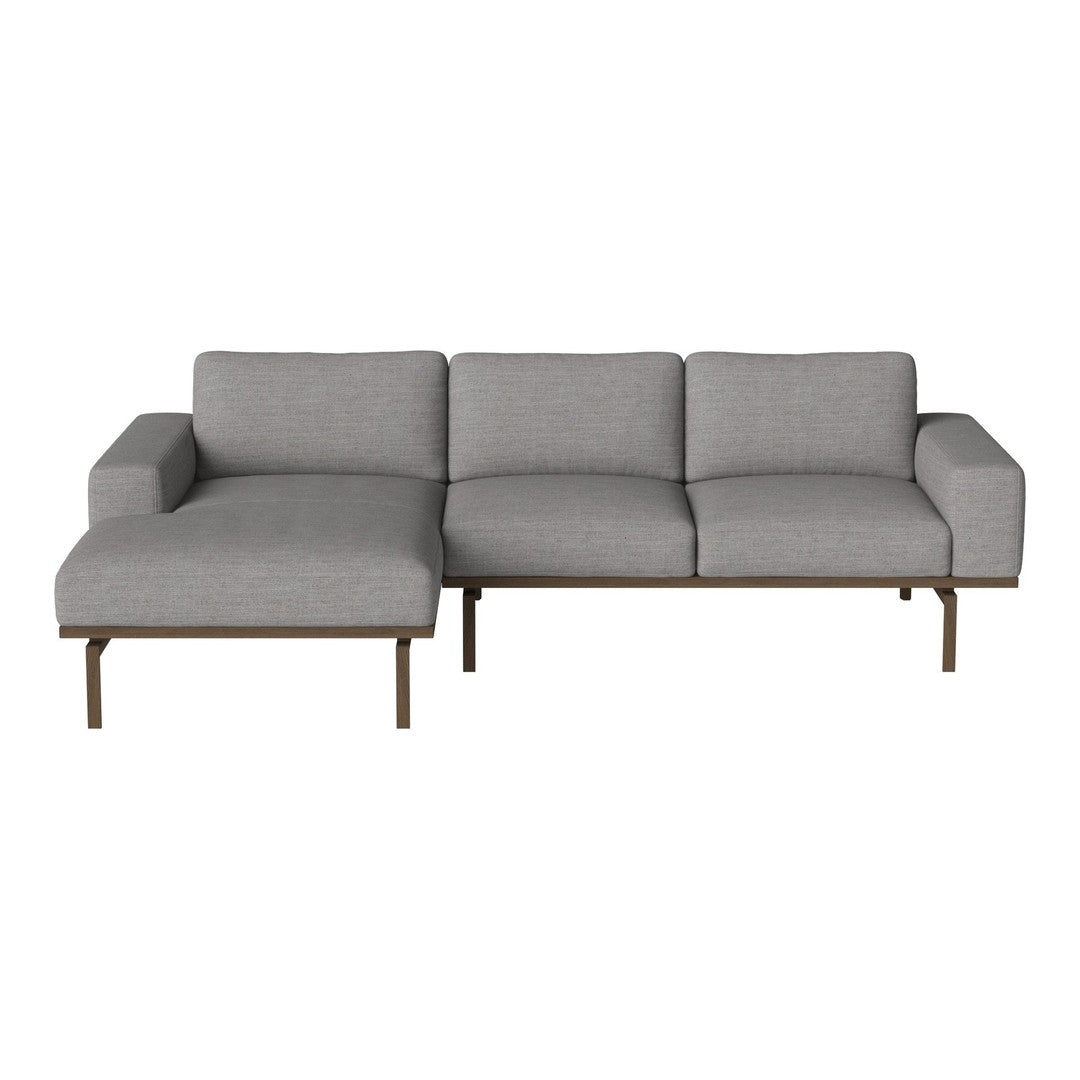 Modern gray sectional sofa with a sleek design and subtle texture, featuring clean lines and a minimalist style.