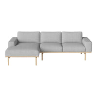 Light gray fabric sectional sofa with a minimalist design and wooden legs, perfect for modern living spaces.