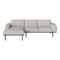 Modern beige sectional sofa with clean lines and soft fabric, featuring a minimalist design and subtle texture.