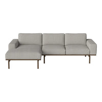 Gray sectional sofa with a sleek, modern design and subtle fabric texture, complemented by a minimalist metal frame.