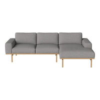 Gray upholstered sectional sofa with clean lines and natural wood legs, featuring a minimalist modern design.