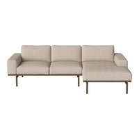 Beige sofa with a minimalist design, featuring smooth lines and subtle texture, perfect for modern decor.