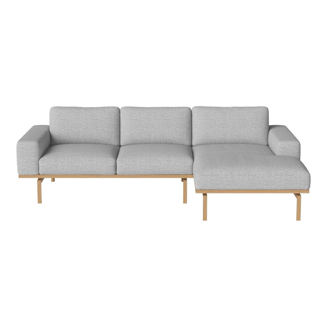 Light gray fabric couch with clean lines and wooden legs, featuring a minimalist modern design. Perfect for contemporary decor.