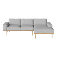 Light gray fabric couch with clean lines and wooden legs, featuring a minimalist modern design. Perfect for contemporary decor.