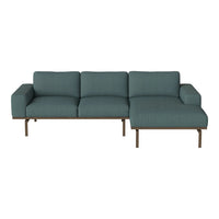 Teal sofa with a clean, minimalist design and subtle textured pattern, featuring a sleek metal frame.