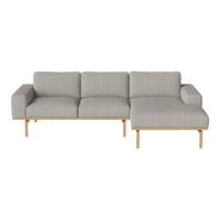 Gray upholstered sofa with a minimalist design and light wooden legs, featuring a solid color without patterns.