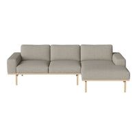 Light gray fabric sofa with a minimalist design, featuring simple lines and wooden legs, perfect for modern interiors.