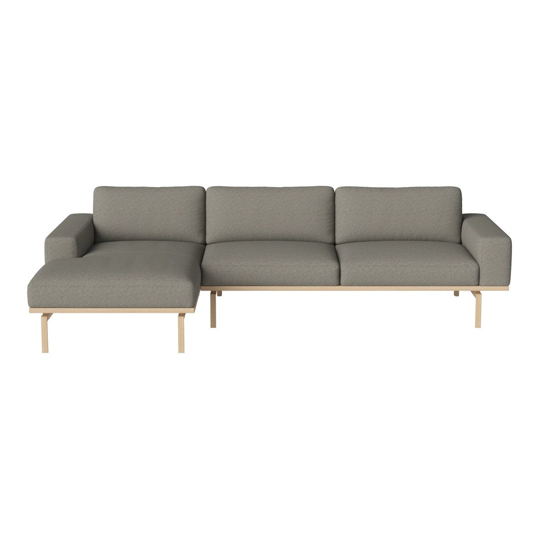 Gray sectional sofa with a minimalist design and light wooden legs, featuring a smooth fabric texture.