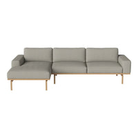 Modern gray fabric sectional sofa with light wood legs, featuring a minimalist design and clean lines.