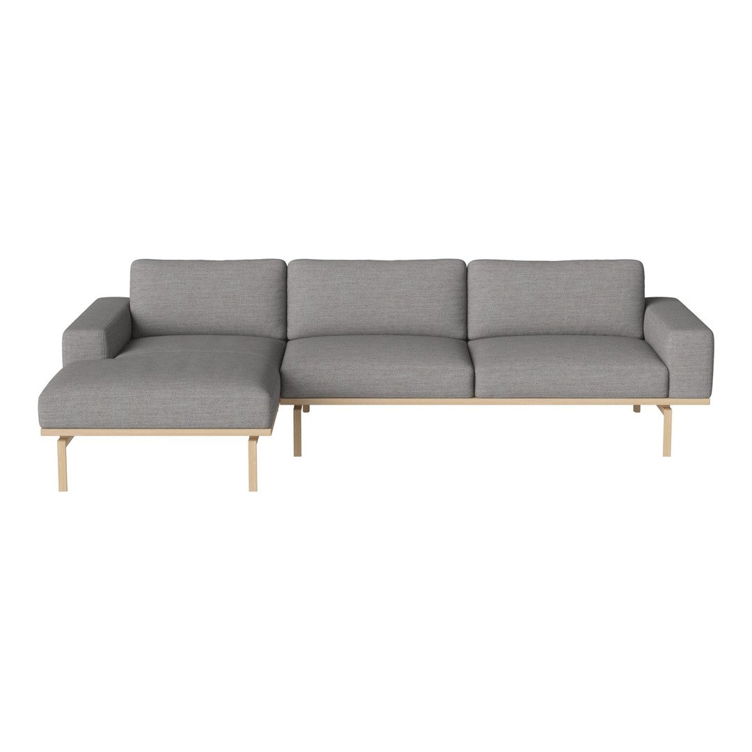 Modern gray sectional sofa with a sleek design and natural wood legs, perfect for contemporary living spaces.