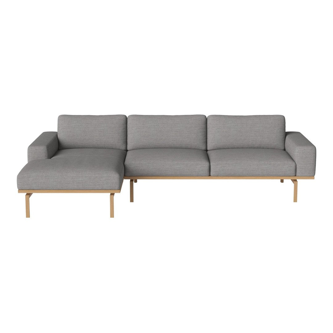 Gray upholstered sectional sofa with a sleek wooden base, featuring clean lines and a minimalist design.