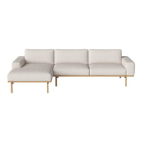 Beige sectional sofa with minimalist design and light wood accents, featuring solid color upholstery and clean lines.