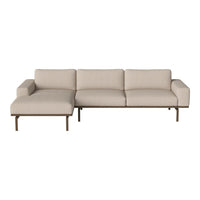 Beige modular sofa with a minimalist design and smooth fabric, featuring neutral tones and clean lines.